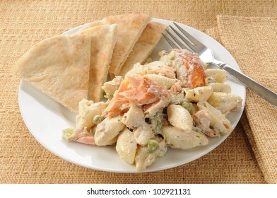 A Salmon And Pasta Salad With Pita Bread