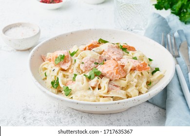 Salmon Pasta, Tagliatelle With Fish And Creamy Sauce. Italian Dinner With Seafood. White Background, Side View