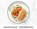 Salmon salted sandwich with spinach and cream cheese, top down view