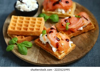 Salmon sandwich on Viennese waffles with ricotta cheese. Delicious waffles with salmon and cream cheese. - Shutterstock ID 2223121995