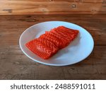 Salmon sashimi, fresh salmon sashimi, Salmon sashimi on white plate on wooden table