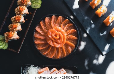 Salmon Sashimi in Japanese buffet restaurant menu.Fresh salmon fillet on black plate salmon slices.Asian people eating sashimi set Japan restaurant.salmon sashimi.Asian Food Menu.seafood sashimi. - Powered by Shutterstock