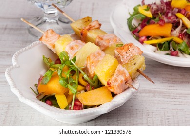 Salmon Skewer With Pineapple, Rice Noodles And Salad With Mango And Pomegranate