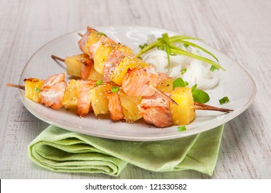 Salmon Skewer With Pineapple, Rice Noodles And Salad With Mango And Pomegranate