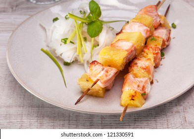 Salmon Skewer With Pineapple, Rice Noodles And Salad With Mango And Pomegranate