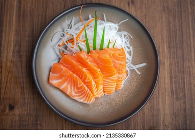 Salmon slice sashimi salad on ceramic bowl japanese food in restuarant  