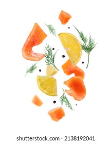Salmon slices with chopped lemon in the air on a white background  - Shutterstock ID 2138192041