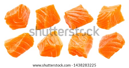 Salmon slices isolated on white background with clipping path, cubes of red fish, ingredient for sushi or salad, macro