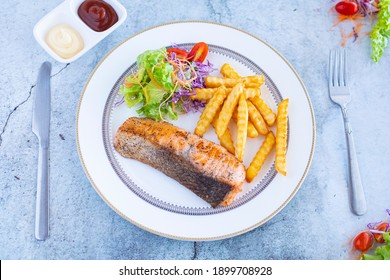 A Salmon Steak Is Different Than A Salmon Fillet. The Fish “steak” Is Cut Crosswise, Perpendicular To The Spine Cutting Through The Bone