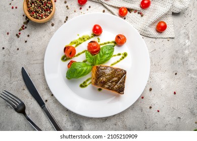 Salmon Steak On The Grill On White Plate On Grey Concrete Table Top View