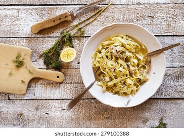 Salmon Tagliatelle On A Plate On Wooden Kitchen Table