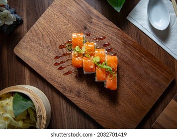 Salmon Ura Maki On Wooden Plate