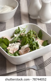 Salmon with watercress and creme fraiche in a bowl