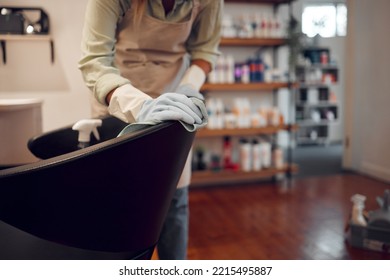 Salon, Small Business And Woman Cleaning Chair With Equipment In Modern Beauty Parlor In City. Cleaner, Maid Or Girl Washing Furniture At Hairdressing Shop With Hygiene And Sanitizing Products.