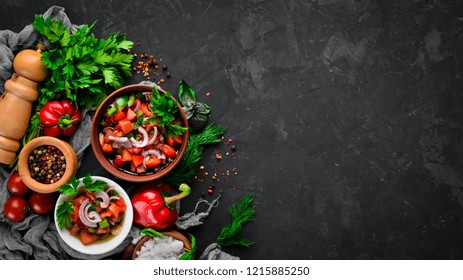 Salsa Sauce And Ingredients. Latin American Mexican Traditional Sauce. Top View. On A Black Background. Free Space For Text.