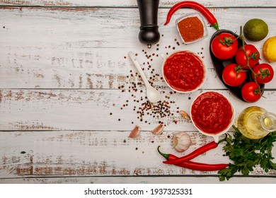 Salsa Sauce. Spicy, Colorful Mexican Salsa Sauce With Hot Peppers And Tomatoes On A Dark Background.Classic Homemade Italian Tomato Sauce  For Pasta  Pizza In  On Wooden Background.