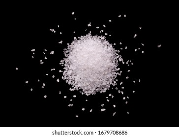 Salt Crystals On A Black Background. A Mound Of Salt On A Black Background. Pile Of Salt Close-up.