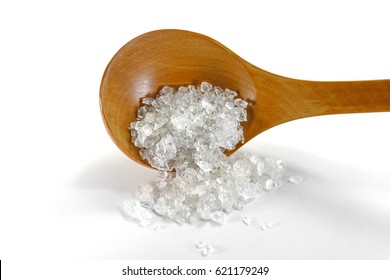 Salt Crystals On Wooden Spoon Isolated On White. 