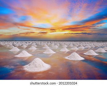 Salt Field In Evaporation Process, In The Afternoon With Colorful Sky Background.