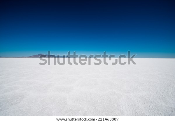 Salt Flats in Utah. Salt Flats\
Landscape. Dark Blue Sky and Snow White Salt Soil. Boneville near\
Salt Lake City, Utah, United States. Bonneville Salt\
Flats