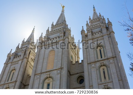 Salt Lake City LDS Mormon Temple spires with sun lighting it from behind