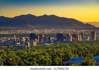 Salt Lake City Skyline At Sunset With Wasatch Mountains In The Background, Utah, USA.