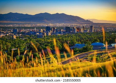 Salt Lake City Skyline At Sunset With Wasatch Mountains In The Background, Utah, USA.