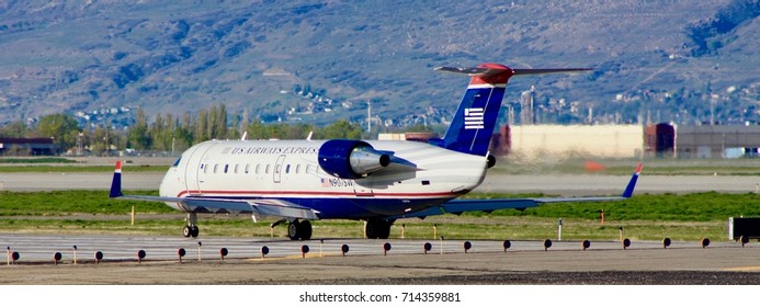 SALT LAKE CITY, UTAH – April 16, 2016: A Bombardier CRJ-200ER Of Skywest Airlines, Operating In US Airways Express Colors, Awaits Takeoff Clearance At Salt Lake City International Airport.