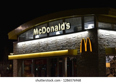 Salt Lake City, Utah / U.S.A. - January 14th 2019: Mc Donald's Restaurant Exterior View At Night With Arches And New Exterior Façade 