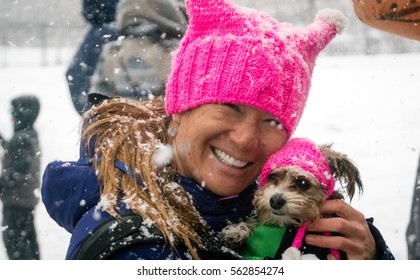 Salt Lake City, Utah, USA - 23rd January, 2017. A woman and her dog wear a pink "pussy hat" at the Women's March in Salt Lake City, Utah