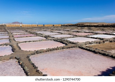 Salt mines at Tenefe cultural park on sunny day in Gran Canaria, Spain. Pozo Izquierdo saltpans production factory in Canary Islands - Shutterstock ID 1290744700