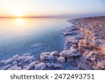 Salt on the shore of the Dead Sea. Jordan sunset landscape