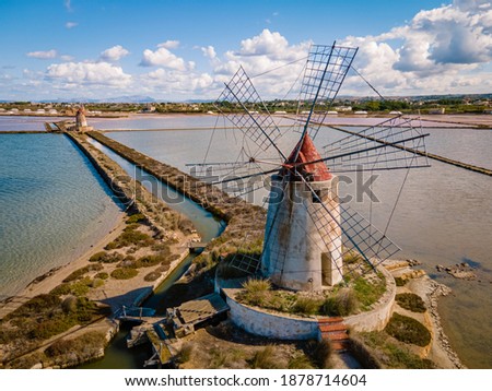 Salt Pans near Marsala at Sicily, Italy in Europe, old windmill at Marsala Sicily