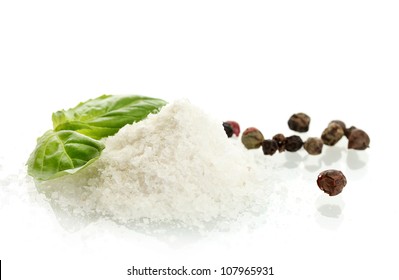 Salt And Pepper With Fresh Basil Isolated On White