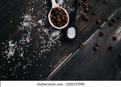 Salt And Pepper On A Board