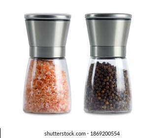 Salt and Pepper Shaker on White Background. Himalayan Pink Sea Salt and Colored Peppercorns in Table Salt Grinders. - Powered by Shutterstock