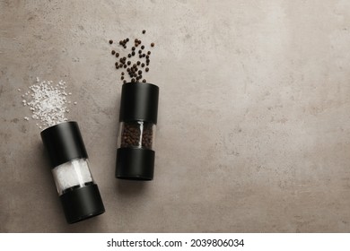 Salt And Pepper Shakers On Light Table, Flat Lay. Space For Text