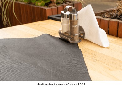 Salt and Pepper Shakers Wooden Table, Salt Container, Spices Jar, Black Pepper Bottle Shakers, Seasoning Mill, Condiments Set on Restaurant Table - Powered by Shutterstock