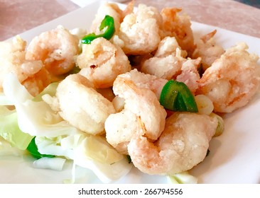 Salt And Pepper Shrimp On A White Plate