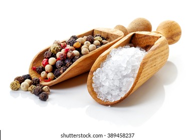 Salt And Pepper In Wooden Shovels On White Background