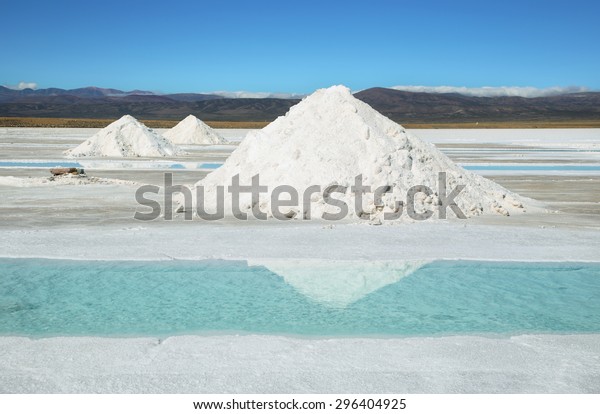 Salt piles and water pool\
on Salinas Grandes salt flats in Jujuy province, northern\
Argentina.