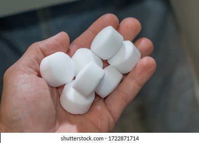 salt for water softener in hand