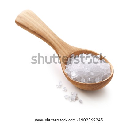 Salt in a wooden spoon isolated on white background
