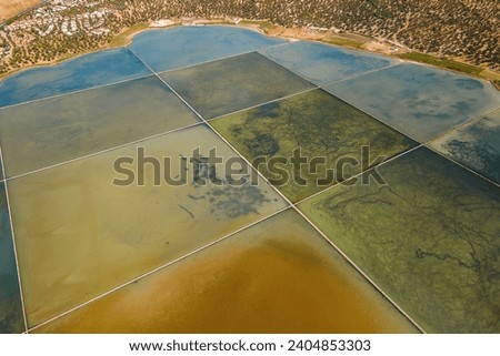 Salt works with evaporation salt pans and fields on coastal Turkey, Aerial shot