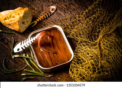 Salted Anchovy Fillets In Olive Oil Tin Can.Artisan Anchovies From Cantabrian Sea Salting With Olive Oil On A Rustic Wooden Table