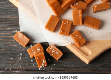 Salted Caramel Candies On Wooden Background, Close Up