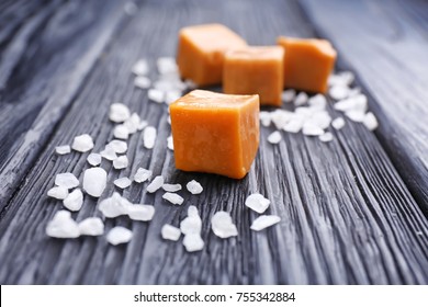 Salted Caramel Candies On Wooden Background