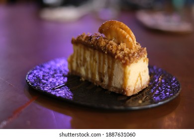 Salted Caramel Cheesecake With Bokeh Background