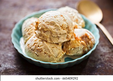 Salted caramel ice creams on blue plate 