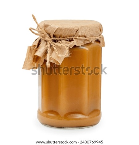 Salted caramel jar on white background, isolated